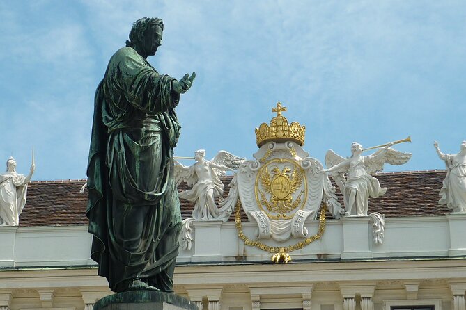 Vienna Secrets Walking Tour to Backyards and Mysterious Locations - Franciscan Church façade views and a cat café stop